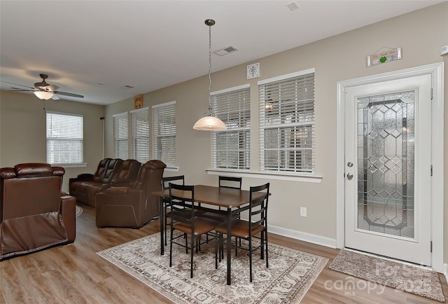 dining room featuring hardwood / wood-style flooring and ceiling fan