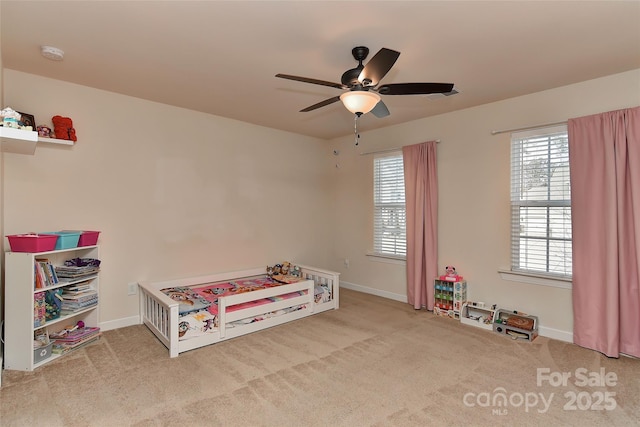 playroom featuring ceiling fan and carpet