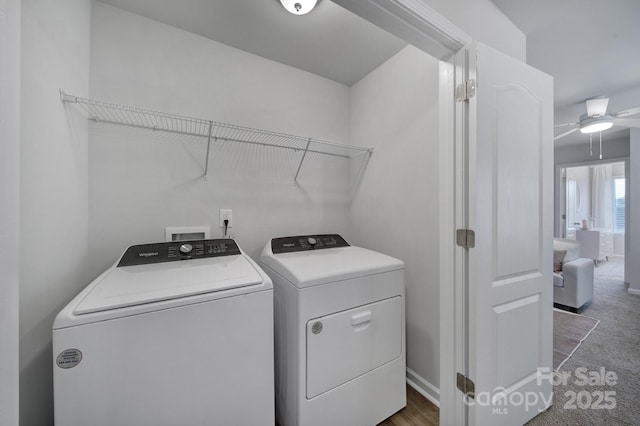 laundry area featuring ceiling fan, separate washer and dryer, and dark colored carpet