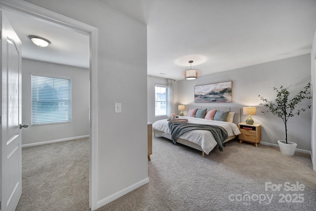 bedroom featuring light carpet