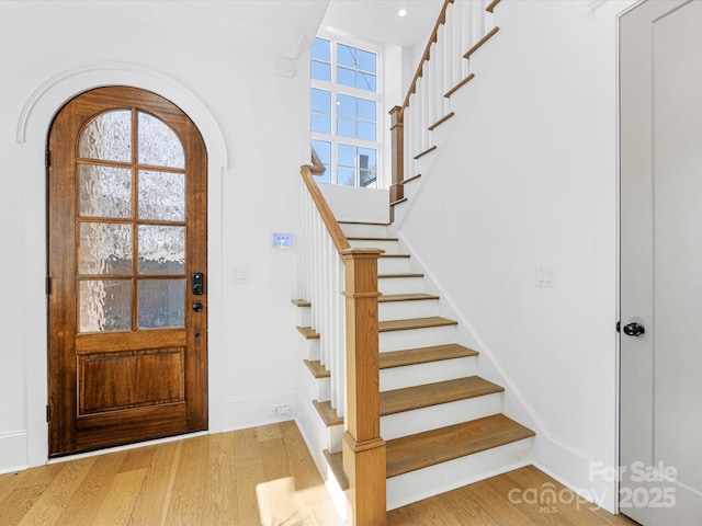 entrance foyer with wood-type flooring and plenty of natural light