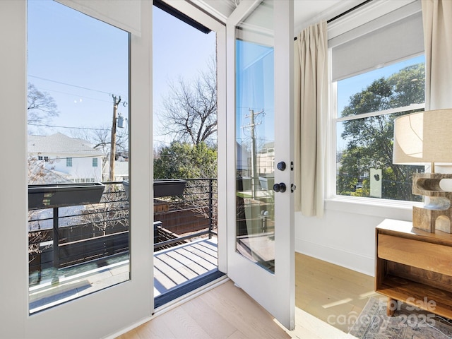 doorway to outside with light hardwood / wood-style floors