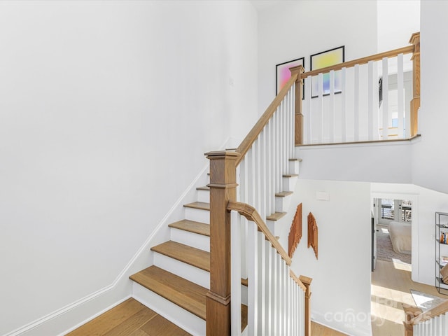 stairs with wood-type flooring