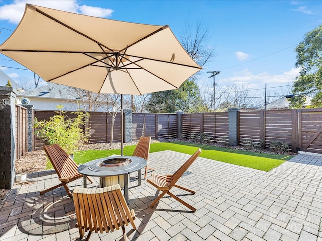 view of patio featuring an outdoor fire pit