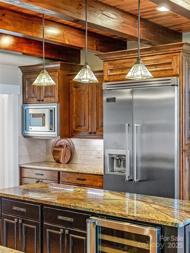 kitchen with built in appliances, beverage cooler, hanging light fixtures, decorative backsplash, and beamed ceiling