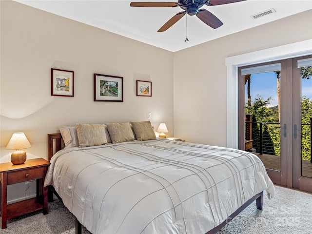 carpeted bedroom with ceiling fan, visible vents, and access to exterior