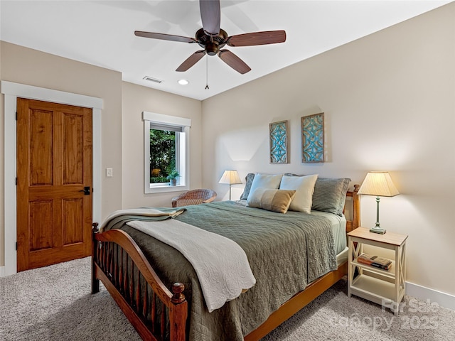 bedroom with light carpet, baseboards, visible vents, and a ceiling fan