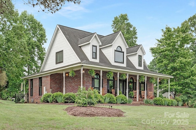 3300 Chancellor Ln, Monroe, NC 28110 - view of front facade featuring brick siding, covered porch, a front lawn, and a shingled roof