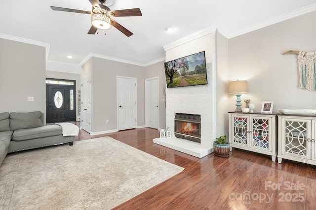 3300 Chancellor Ln, Monroe, NC 28110 - living area featuring ceiling fan, ornamental molding, wood finished floors, a brick fireplace, and recessed lighting