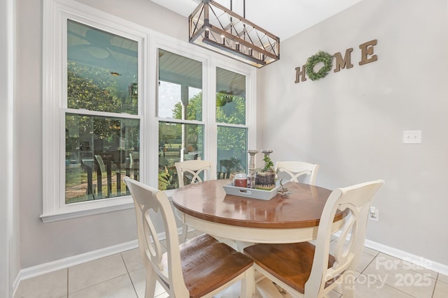 3300 Chancellor Ln, Monroe, NC 28110 - dining room featuring light tile patterned flooring, a chandelier, and baseboards