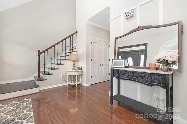 3300 Chancellor Ln, Monroe, NC 28110 - entryway with wood finished floors, stairs, a towering ceiling, baseboards, and crown molding