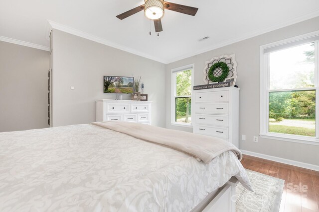 3300 Chancellor Ln, Monroe, NC 28110 - bedroom with wood finished floors, crown molding, baseboards, vaulted ceiling, and ceiling fan