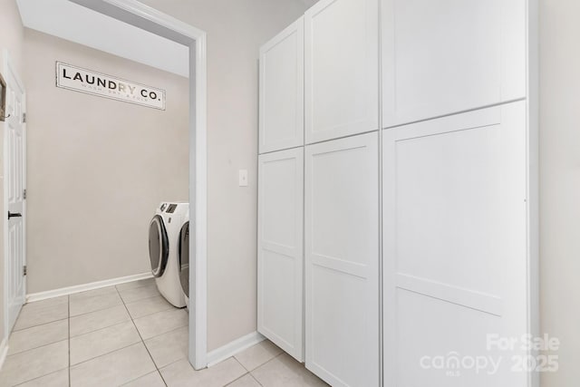 3300 Chancellor Ln, Monroe, NC 28110 - laundry room with washer and dryer, light tile patterned flooring, and baseboards