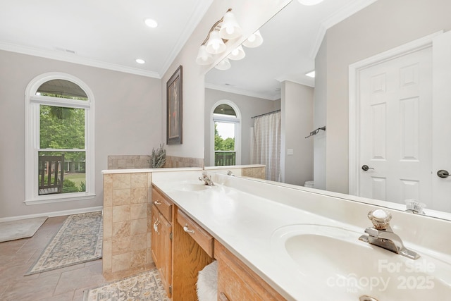 3300 Chancellor Ln, Monroe, NC 28110 - full bathroom with crown molding, double vanity, recessed lighting, and toilet