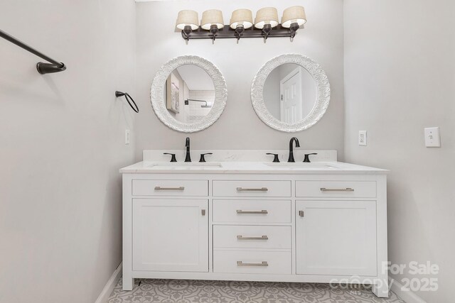 3300 Chancellor Ln, Monroe, NC 28110 - full bath featuring baseboards and double vanity