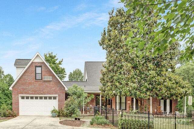 3300 Chancellor Ln, Monroe, NC 28110 - view of front of house featuring driveway, brick siding, fence, and a shingled roof