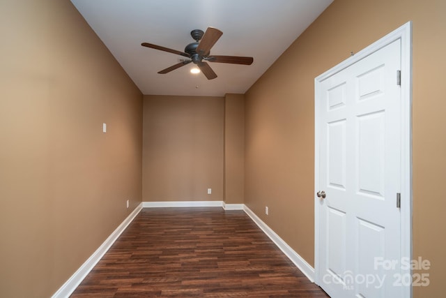 unfurnished room with dark wood-type flooring and ceiling fan