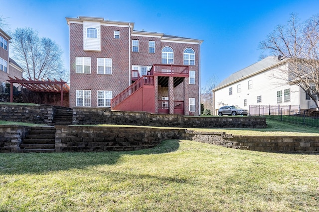 rear view of house with a lawn