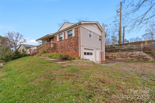 view of property exterior with a garage and a lawn