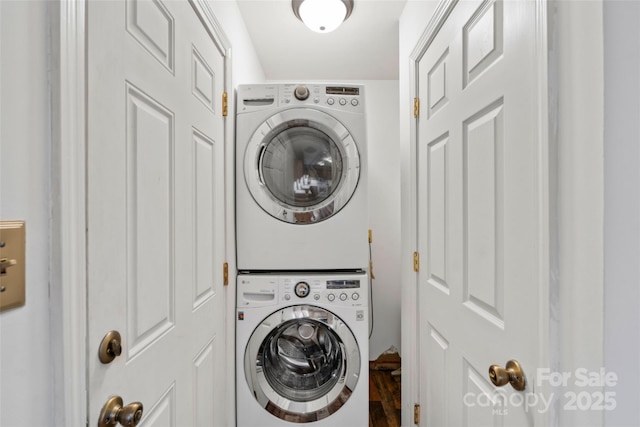 laundry area featuring stacked washing maching and dryer