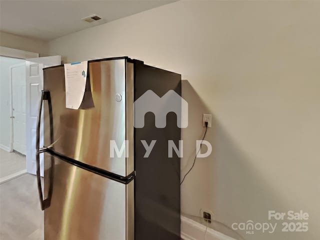 interior details featuring stainless steel refrigerator