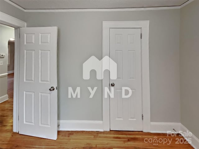 details with crown molding and hardwood / wood-style floors