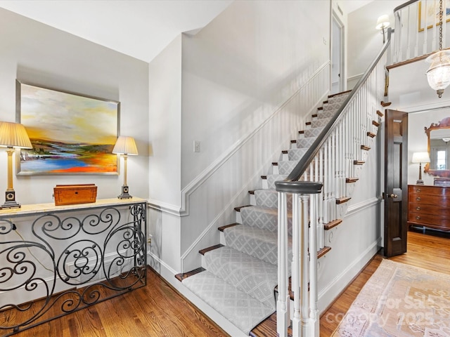 stairway featuring hardwood / wood-style flooring