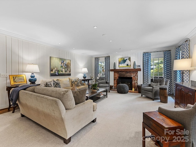 living room with crown molding, light carpet, and a fireplace