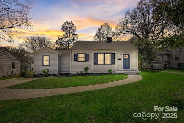 single story home featuring a yard