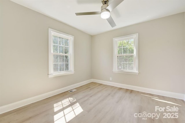 unfurnished room with ceiling fan and light hardwood / wood-style floors