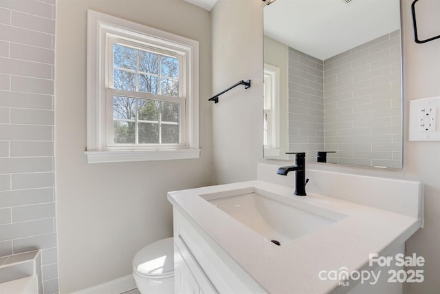 bathroom with vanity and toilet