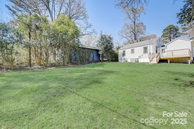 view of yard with a deck