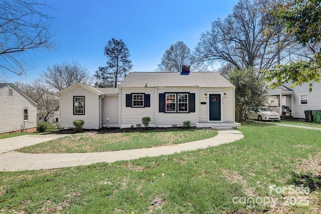 ranch-style house featuring a front lawn