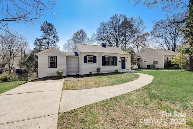 ranch-style home with a front lawn