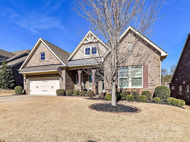 craftsman inspired home with a garage and a porch