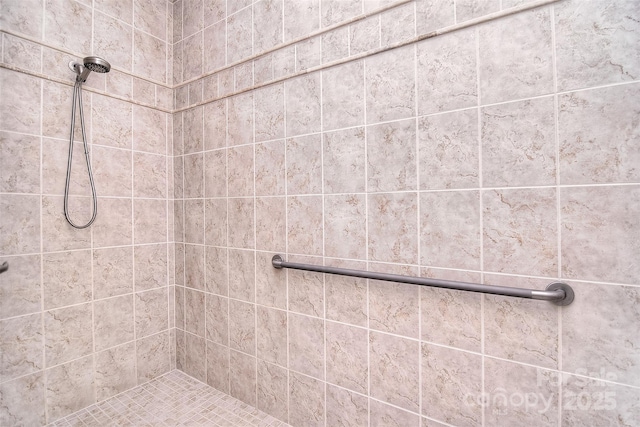 bathroom with tiled shower