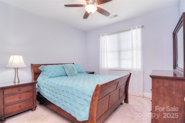 bedroom with light colored carpet and ceiling fan