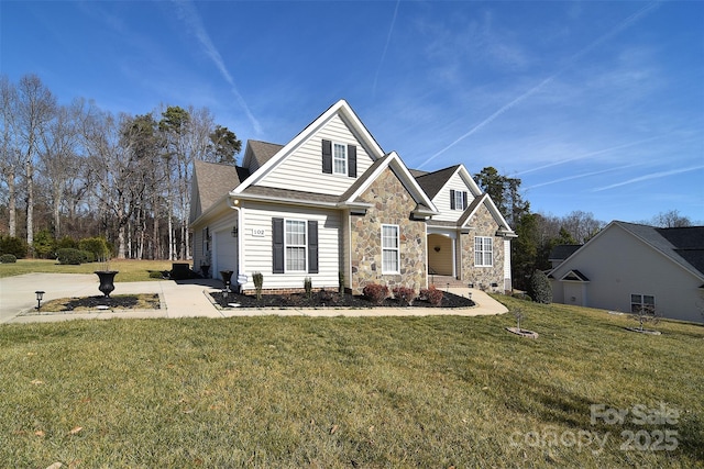 view of front of home featuring a garage and a front lawn