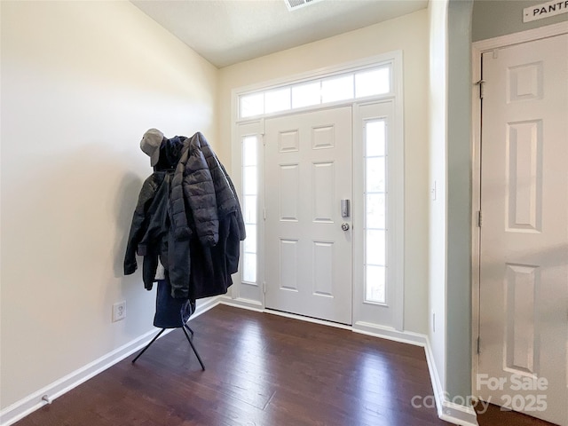 foyer entrance with dark hardwood / wood-style flooring