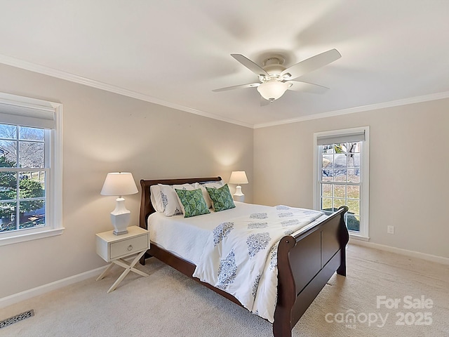 bedroom featuring crown molding and light colored carpet