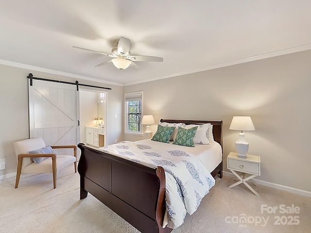 bedroom featuring ensuite bathroom, ceiling fan, crown molding, a barn door, and light carpet