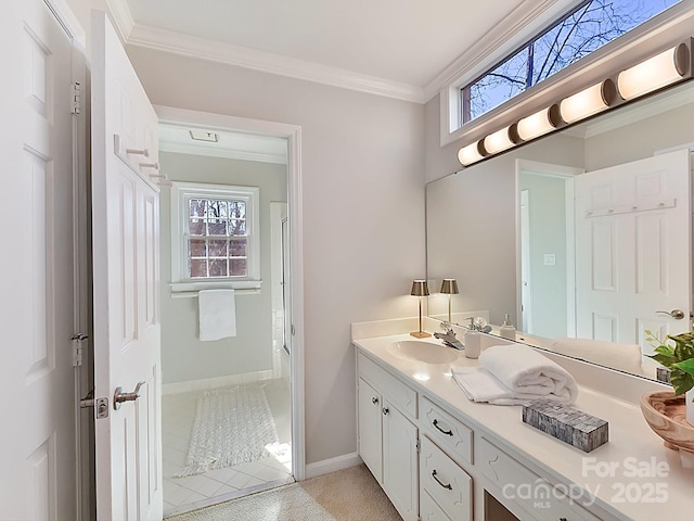 bathroom with vanity, ornamental molding, and walk in shower