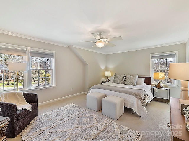 carpeted bedroom featuring crown molding and ceiling fan