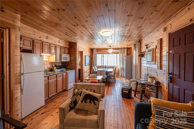 kitchen featuring wood ceiling, white appliances, wood walls, and light wood-type flooring