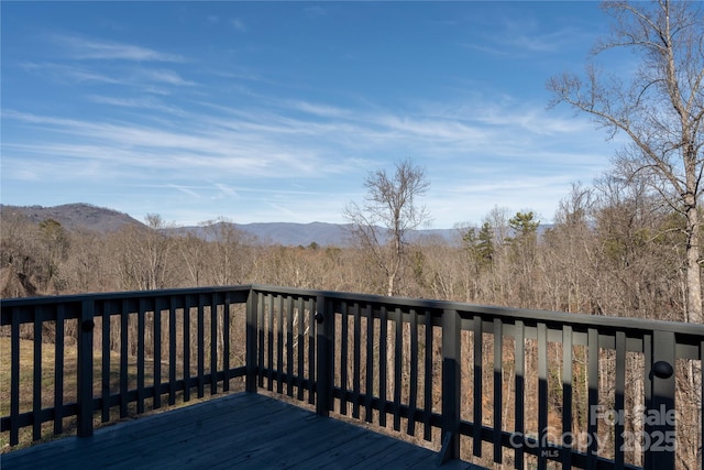 wooden terrace featuring a mountain view