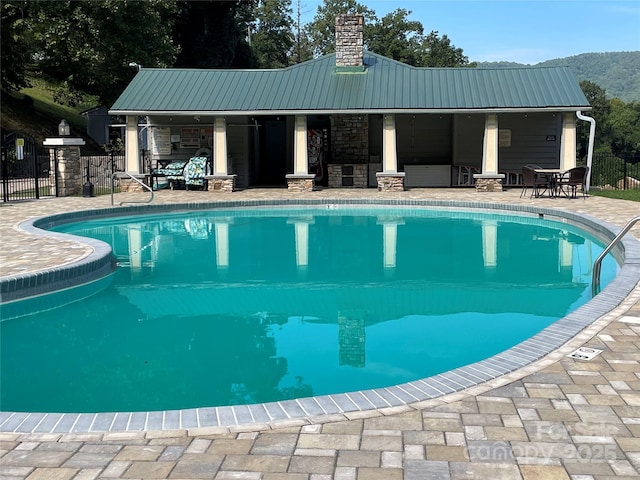 view of swimming pool featuring a patio area