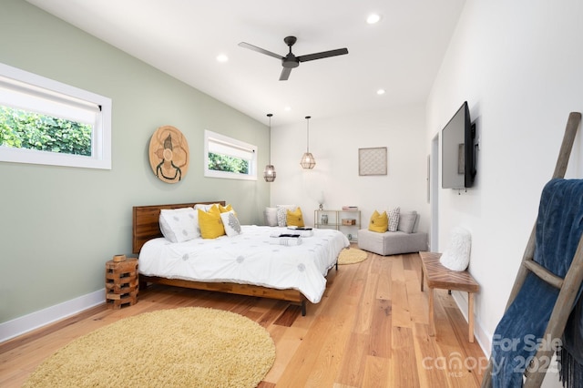 bedroom featuring hardwood / wood-style flooring and ceiling fan