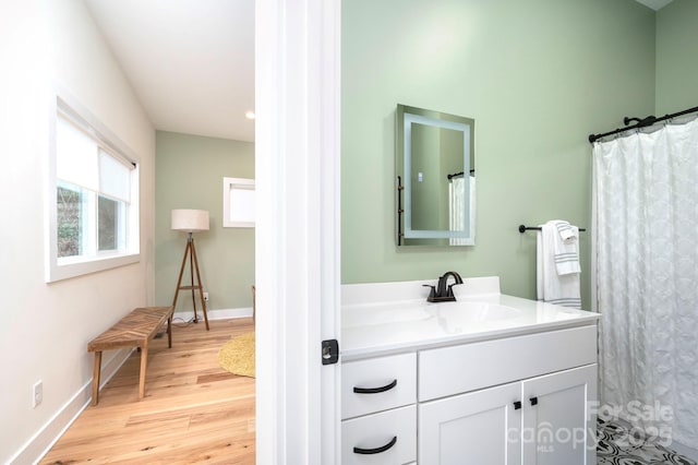 bathroom featuring vanity and wood-type flooring