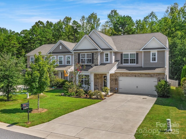 view of front of house with a garage and a front lawn