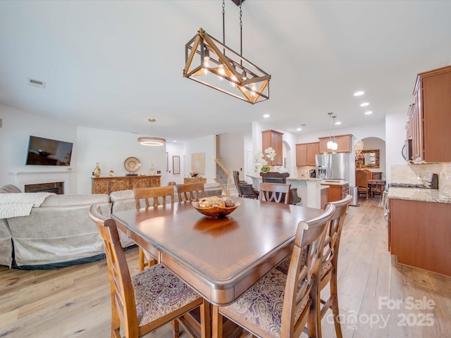 dining room featuring light hardwood / wood-style flooring